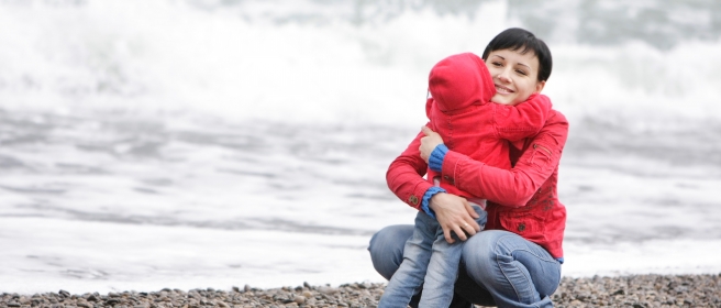 woman and child beach clouds 62803909